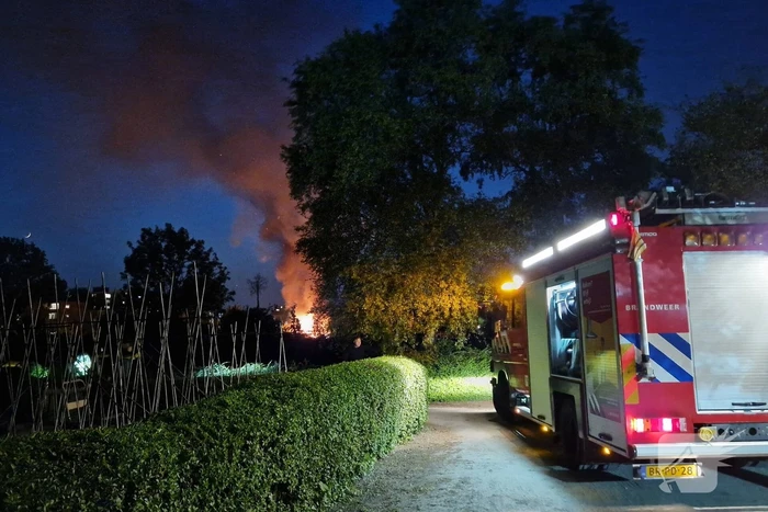 Tuinhuis in as na felle brand
