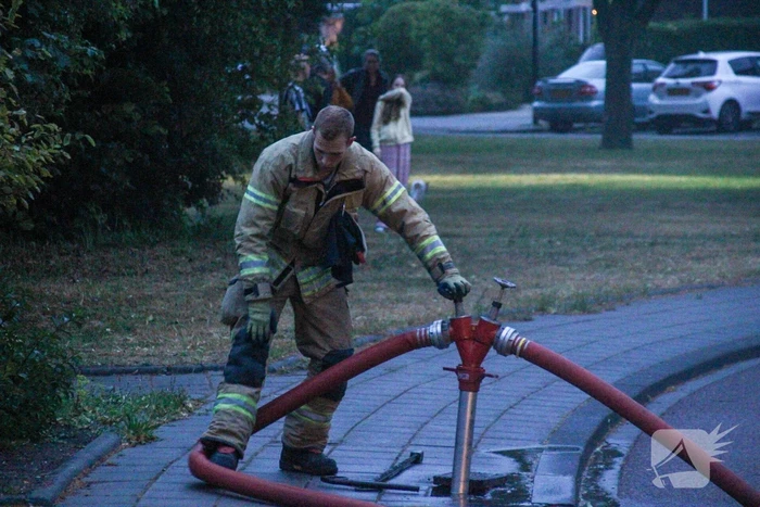 Brand in woning, persoon aangehouden