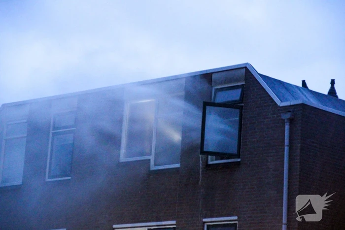Brand in woning, persoon aangehouden