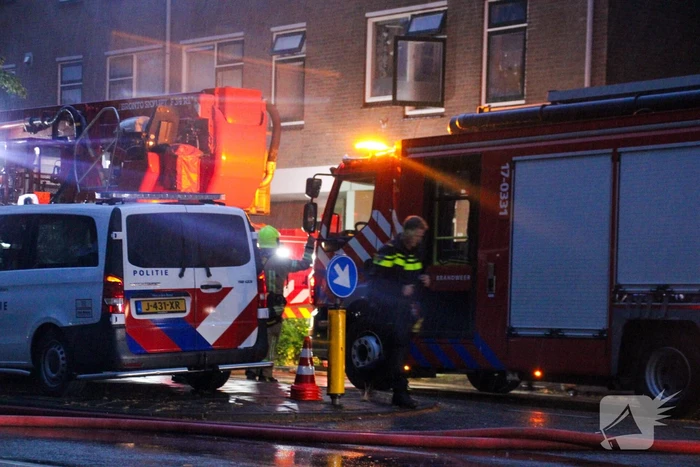Brand in woning, persoon aangehouden