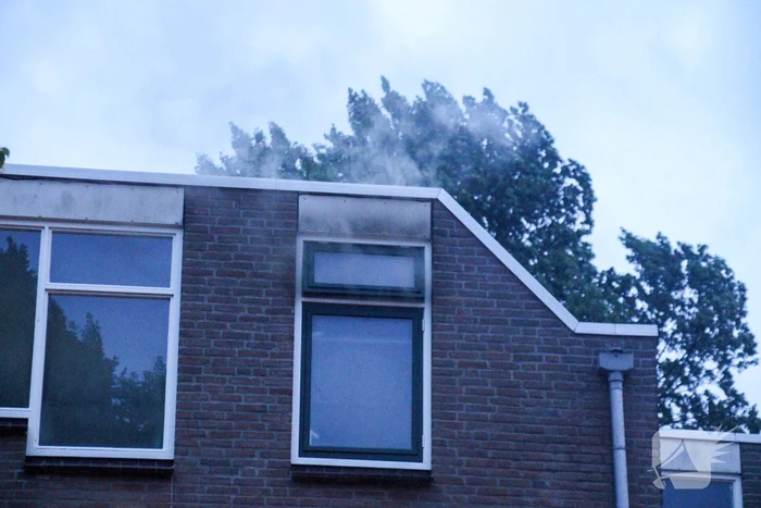 Brand in woning, persoon aangehouden