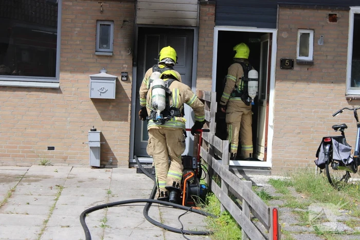 Woning flink beschadigd na brand, brandstichter aangehouden