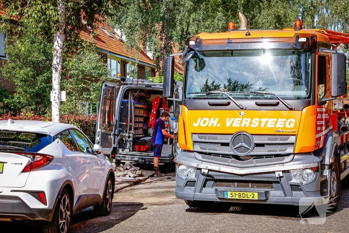 Straat afgezet door waterlekkage