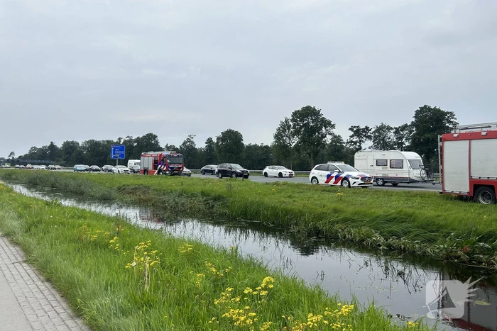 Flinke file door voertuig te water