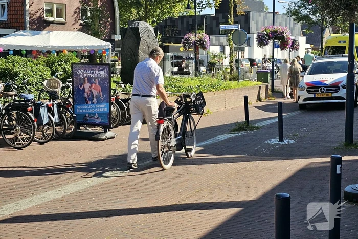 Persoon ten val met fiets