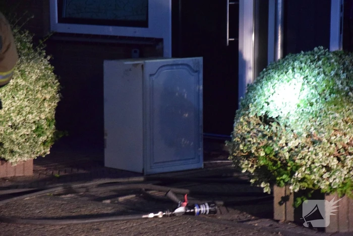 Kortsluiting koelkast veroorzaakt brand