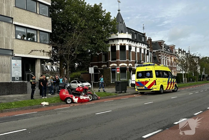 Zijspan in botsing met automobilist