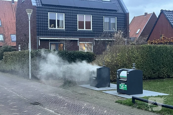 Ondergrondse container in brand