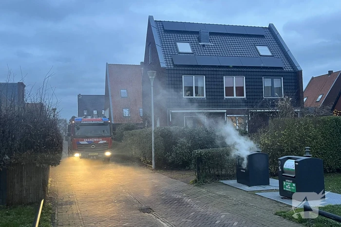 Ondergrondse container in brand