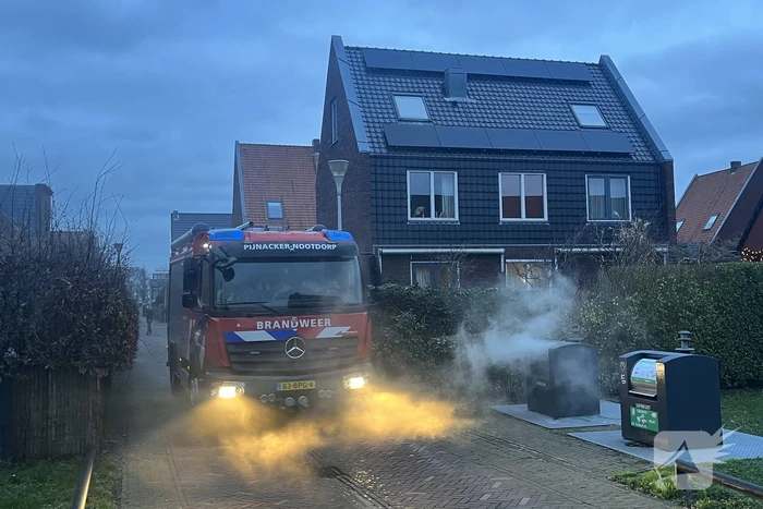 Ondergrondse container in brand