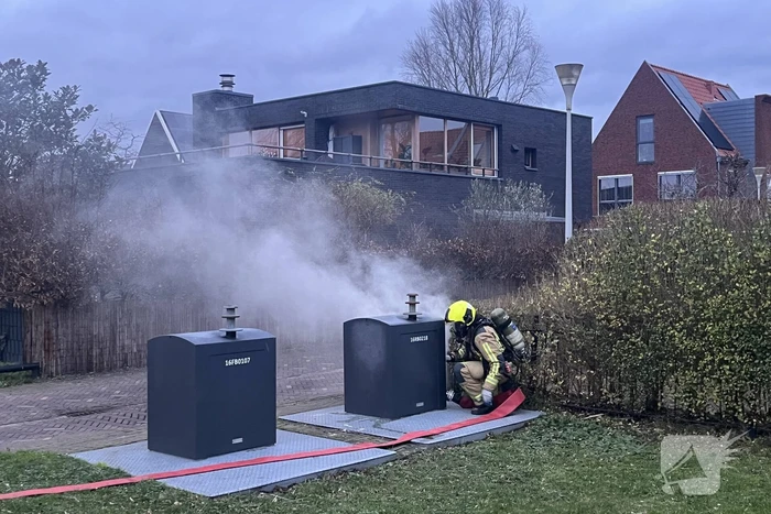 Ondergrondse container in brand