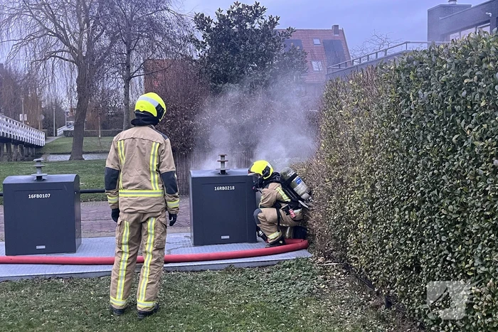 Ondergrondse container in brand