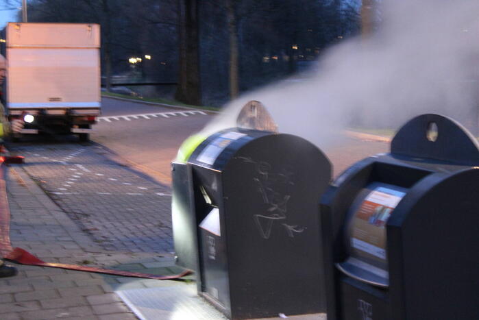 Ondergrondse container in brand