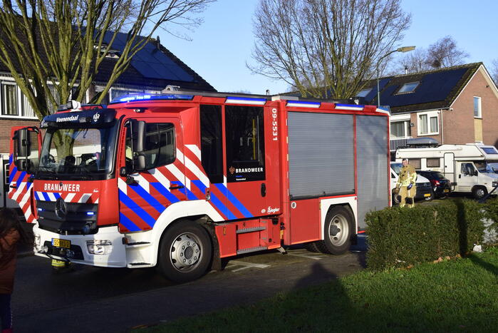 Gordijnen vatten vlam in woning