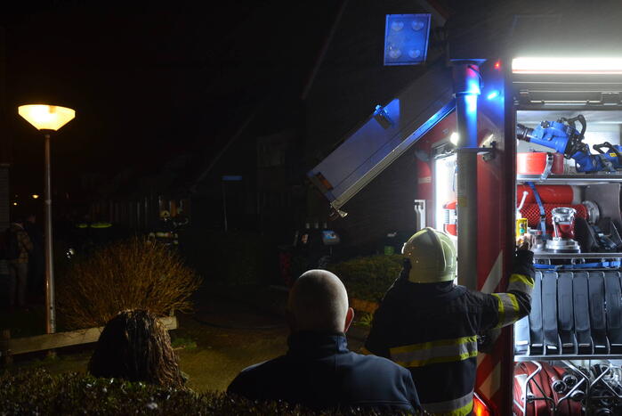 Brand in portiek woning