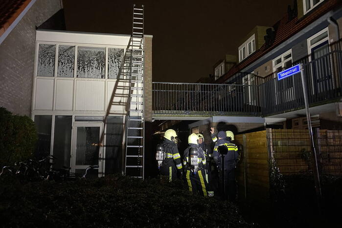 Brand in portiek woning