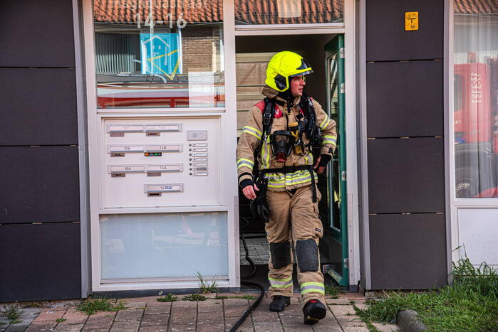Brand in slaapkamer van portiekwoning