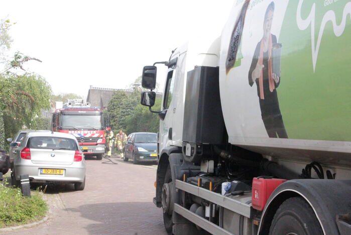 Laadruimte vuilniswagen vat vlam