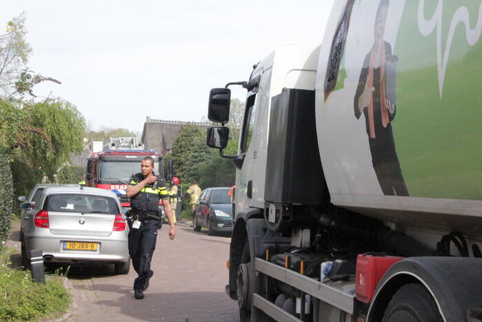 Laadruimte vuilniswagen vat vlam