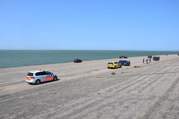 Fietser en automobilist in botsing