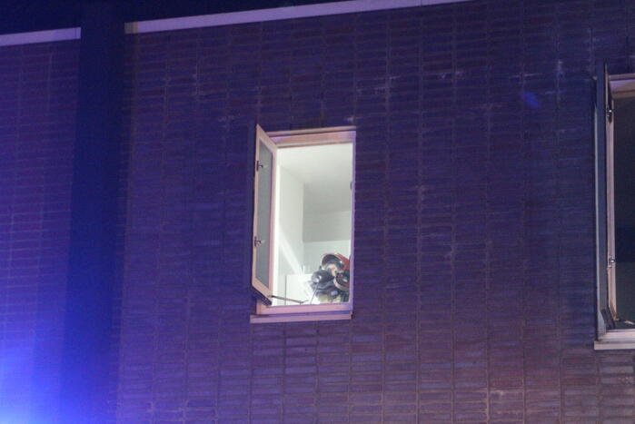 Buurman ontdekt brand in woning