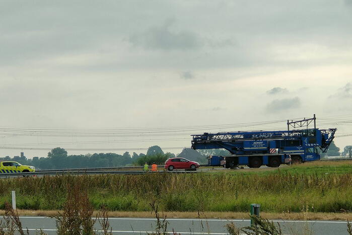 File na stilgevallen kraanwagen