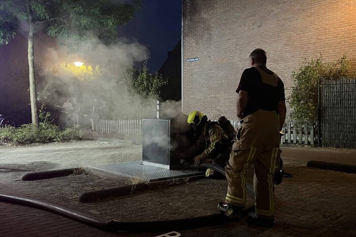 Brand in ondergrondse container