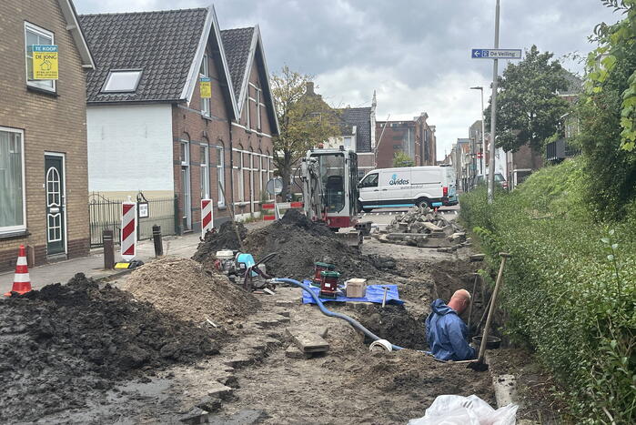 Schade aan weg door waterlekkage