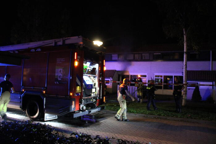 Rookontwikkeling uit woning, persoon naar ziekenhuis