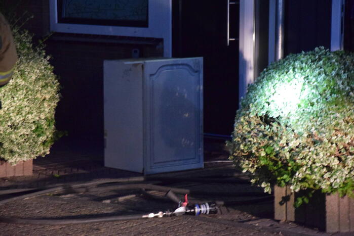Kortsluiting koelkast veroorzaakt brand