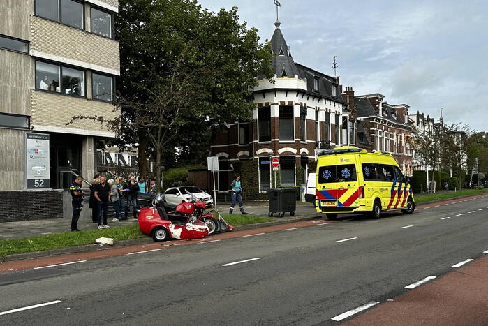 Zijspan in botsing met automobilist