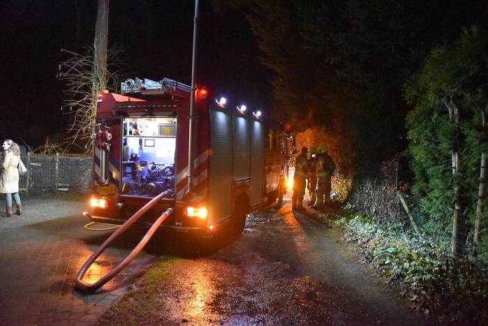 Containerhok verwoest door brand