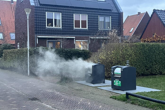 Ondergrondse container in brand