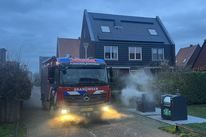 Ondergrondse container in brand