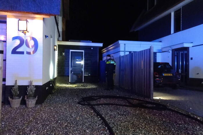 Afvalbrand bij woning