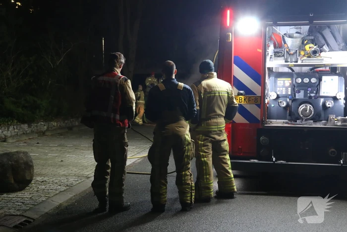 Brand in container met bouwafval