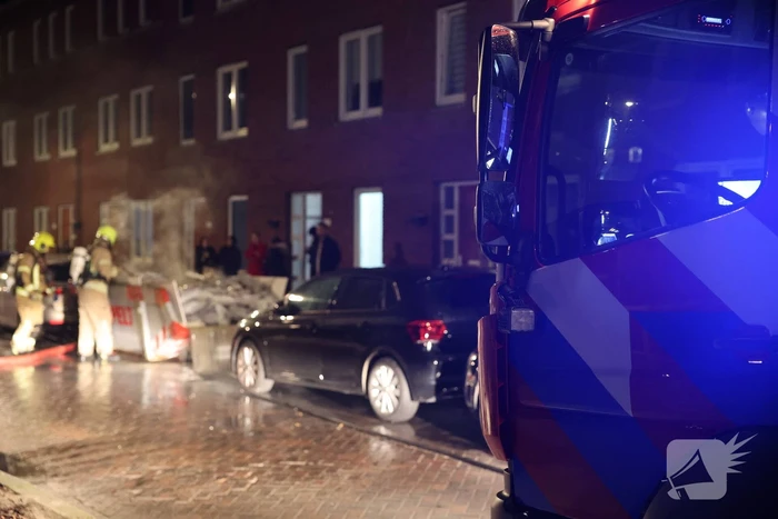 Brand in container met bouwafval