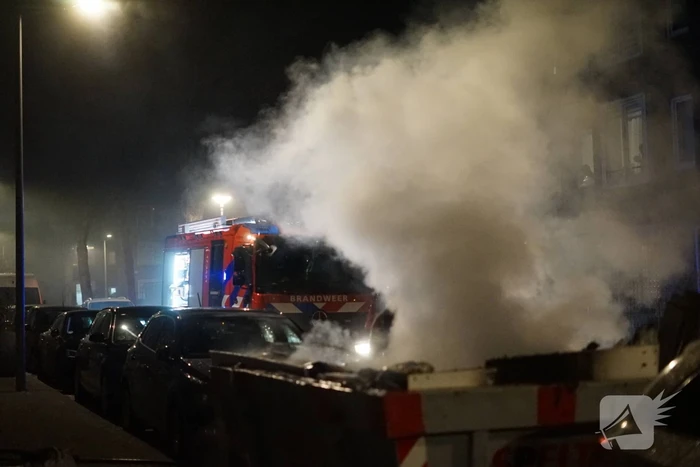 Brand in container met bouwafval