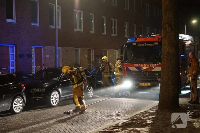 Brand in container met bouwafval