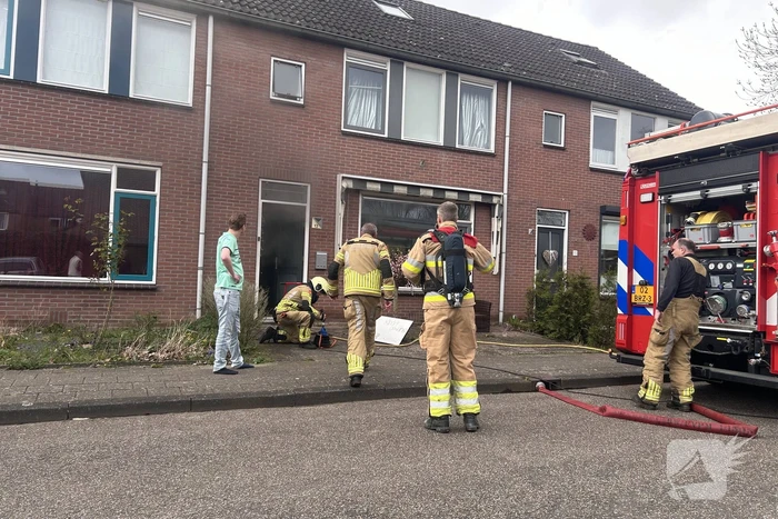 Rookontwikkeling bij brand in keuken van woning