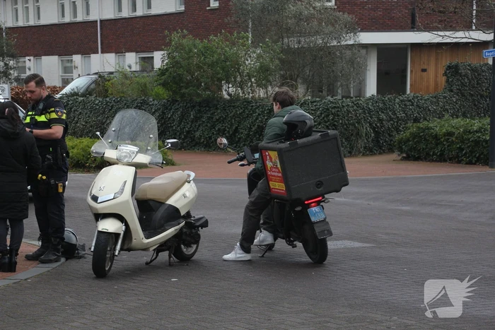 Scooters in botsing op kruising