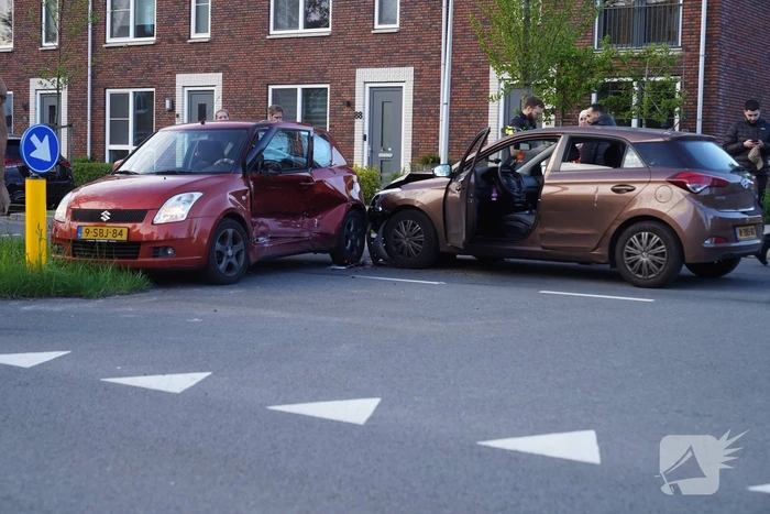 Schade na botsing op kruising