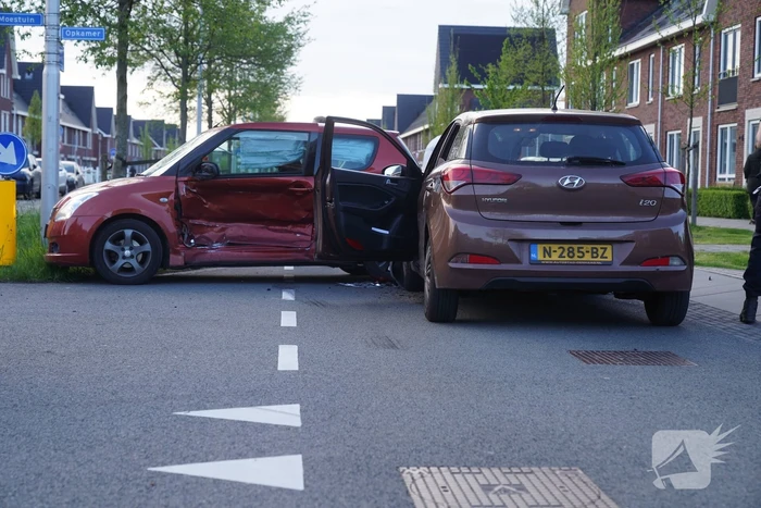 Schade na botsing op kruising