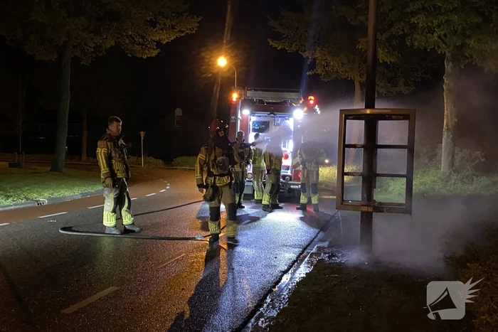 Reclamebord in brand gestoken