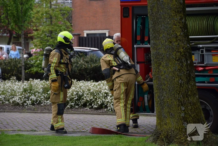 Fikse rookontwikkeling bij brand in textiel container