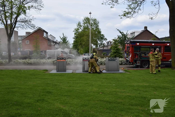 Fikse rookontwikkeling bij brand in textiel container