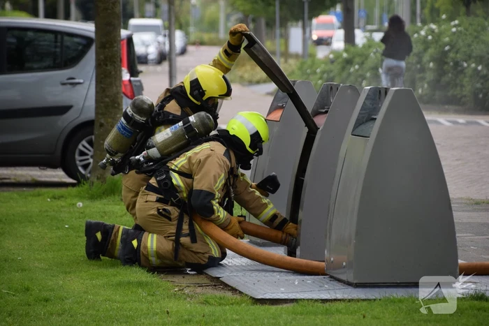 Fikse rookontwikkeling bij brand in textiel container