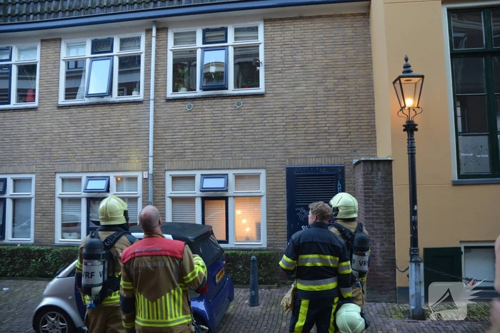 Appartement vol rook door keukenbrand