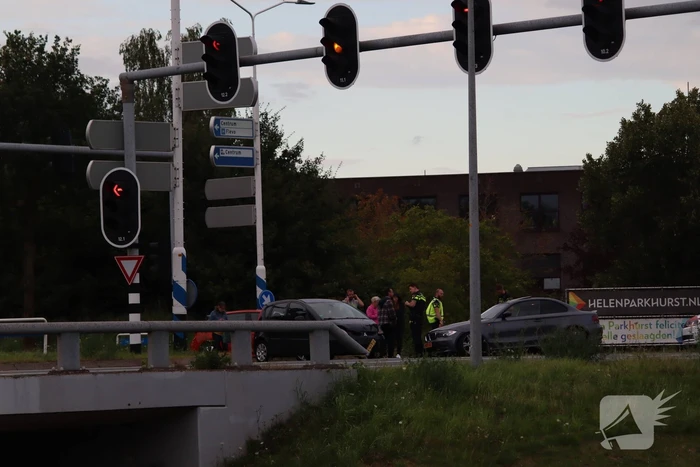 Schade na botsing op kruising