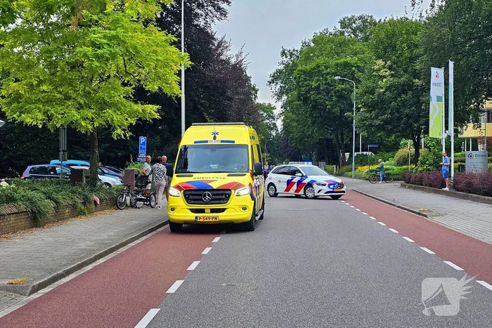 Persoon op driewieler ten val